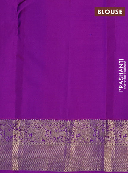 Pure kanchipuram silk saree dual shade of bluish green and purple with allover zari stripe weaves and rich zari woven border