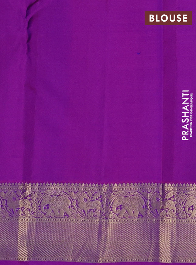 Pure kanchipuram silk saree dual shade of bluish green and purple with allover zari stripe weaves and rich zari woven border