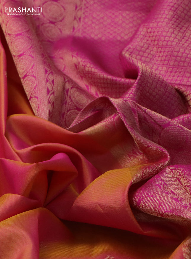 Pure kanchipuram silk saree dual shade of pinkish orange and pink with allover zari woven buttas and ganga jamun border