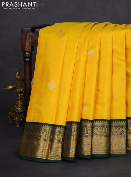 Pure kanchipuram silk saree yellow and bottle green with zari woven buttas and rich zari woven korvai border