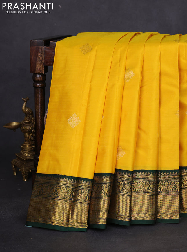 Pure kanchipuram silk saree yellow and bottle green with zari woven buttas and rich zari woven korvai border