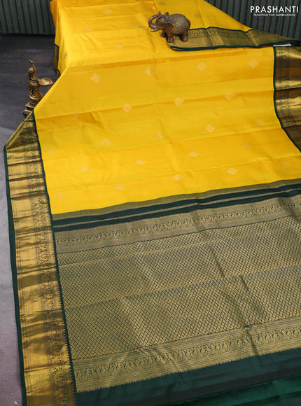 Pure kanchipuram silk saree yellow and bottle green with zari woven buttas and rich zari woven korvai border