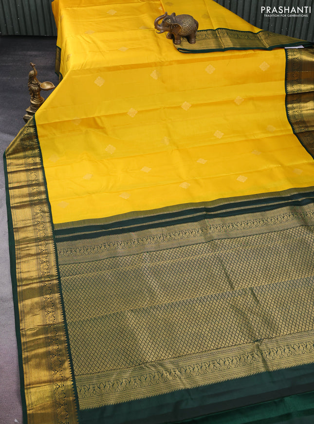Pure kanchipuram silk saree yellow and bottle green with zari woven buttas and rich zari woven korvai border