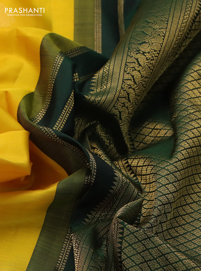 Pure kanchipuram silk saree yellow and bottle green with zari woven buttas and rich zari woven korvai border