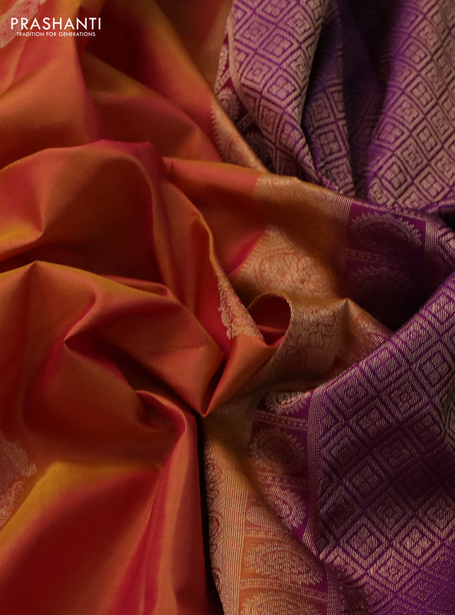 Pure kanchipuram silk saree dual shade of dark mustard and purple with zari woven buttas and rettapet zari woven border