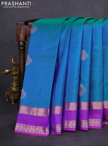 Pure kanchipuram silk saree dual shade of teal greenish blue and purple with zari woven buttas and rettapet zari woven border