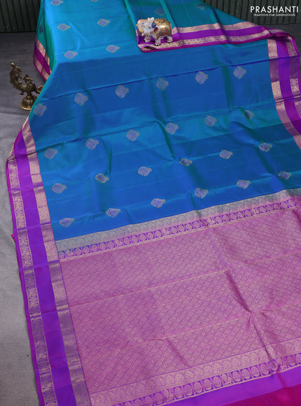 Pure kanchipuram silk saree dual shade of teal greenish blue and purple with zari woven buttas and rettapet zari woven border