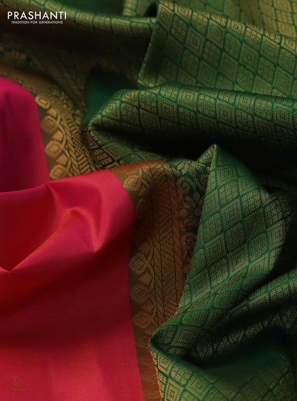Pure kanchipuram silk saree dual shade of pinkish orange and green with zari woven buttas and rettapet zari woven border
