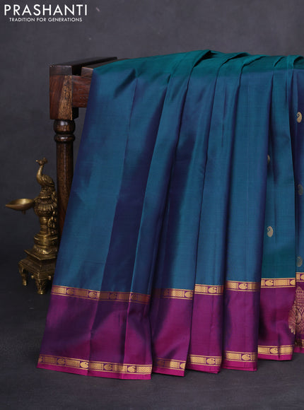 Pure kanchipuram silk saree dual shade of peacock green and purple with zari woven paisley buttas and zari woven butta border