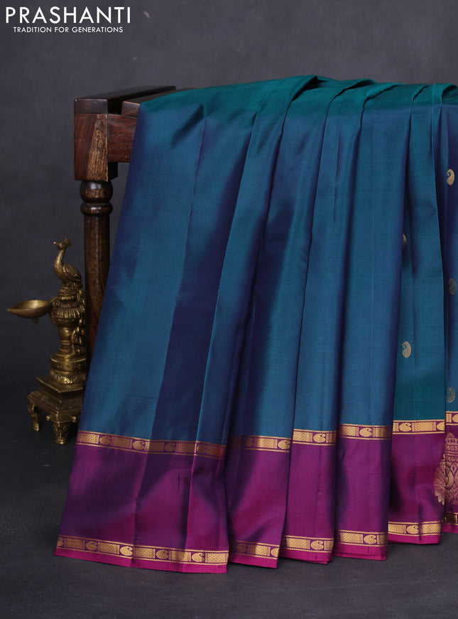 Pure kanchipuram silk saree dual shade of peacock green and purple with zari woven paisley buttas and zari woven butta border