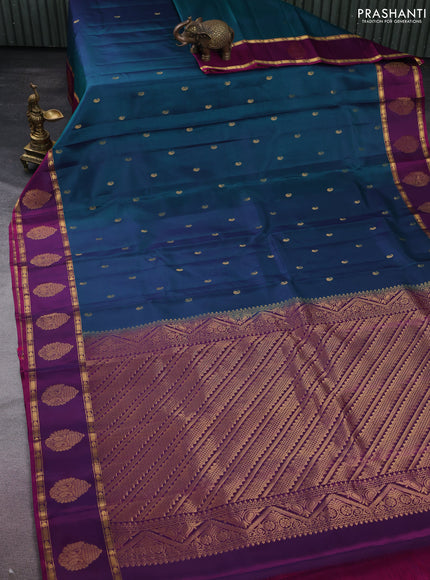 Pure kanchipuram silk saree dual shade of peacock green and purple with zari woven paisley buttas and zari woven butta border