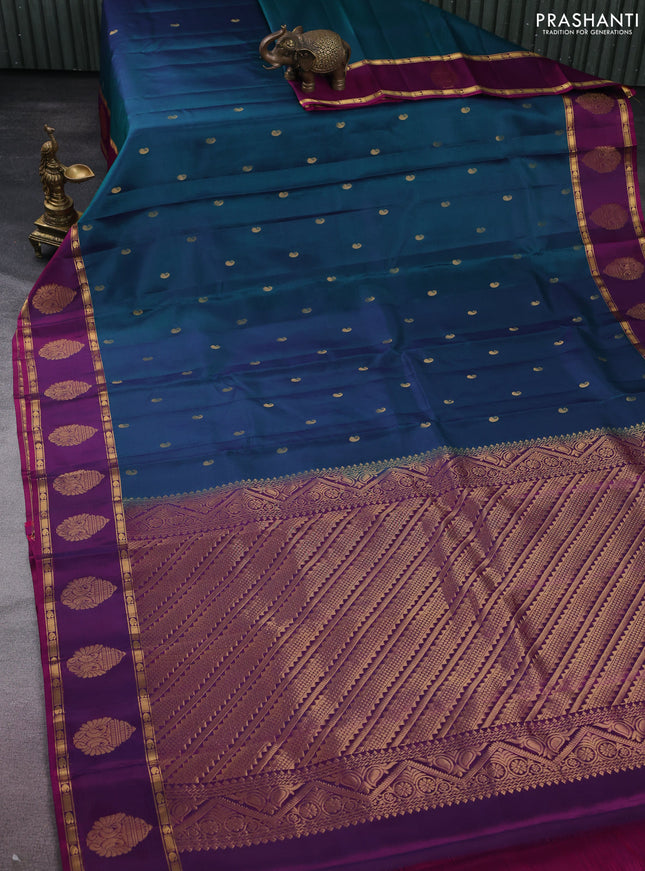 Pure kanchipuram silk saree dual shade of peacock green and purple with zari woven paisley buttas and zari woven butta border