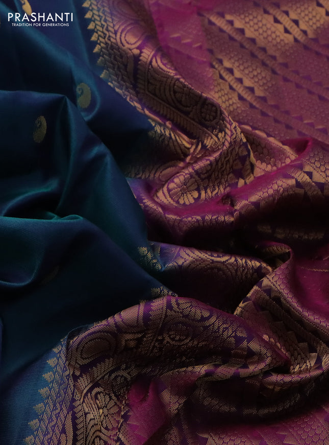 Pure kanchipuram silk saree dual shade of peacock green and purple with zari woven paisley buttas and zari woven butta border