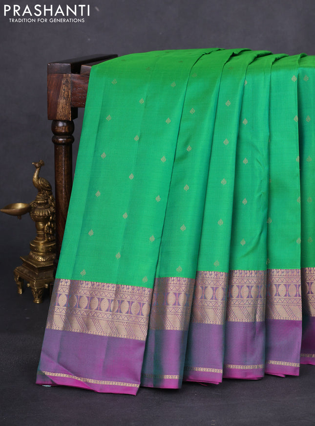 Pure kanchipuram silk saree green and purple with allover zari woven buttas and rettapet zari woven border