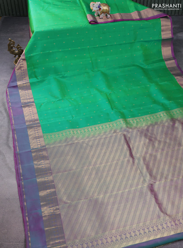Pure kanchipuram silk saree green and purple with allover zari woven buttas and rettapet zari woven border