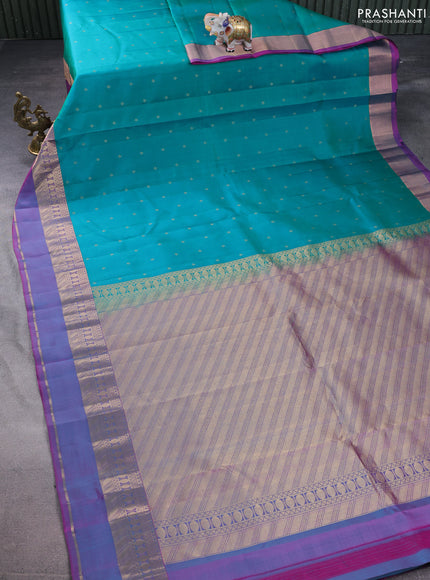 Pure kanchipuram silk saree teal green and purple with allover zari woven buttas and rettapet zari woven border