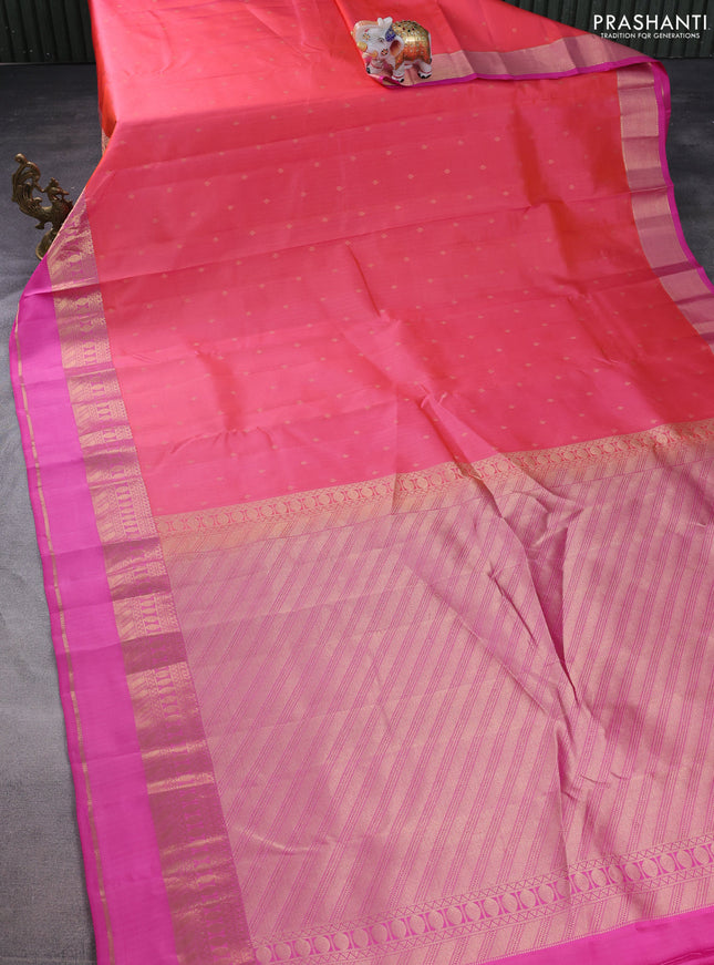 Pure kanchipuram silk saree dual shade of peach shade and pink with allover zari woven buttas and rettapet zari woven border