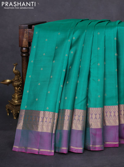 Pure kanchipuram silk saree green and dual shade of purple with allover zari woven buttas and rettapet zari woven border