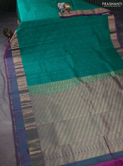 Pure kanchipuram silk saree green and dual shade of purple with allover zari woven buttas and rettapet zari woven border