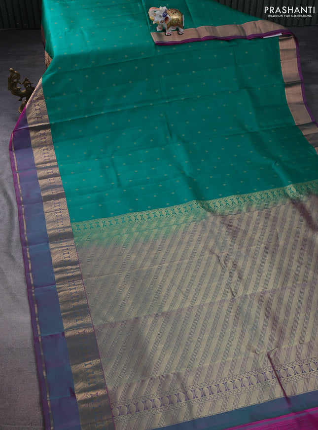 Pure kanchipuram silk saree green and dual shade of purple with allover zari woven buttas and rettapet zari woven border