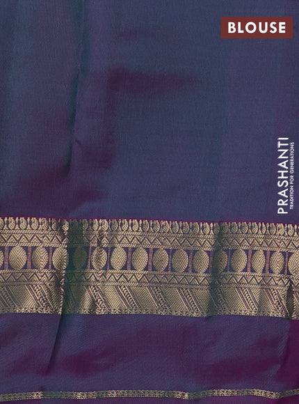 Pure kanchipuram silk saree green and dual shade of purple with allover zari woven buttas and rettapet zari woven border