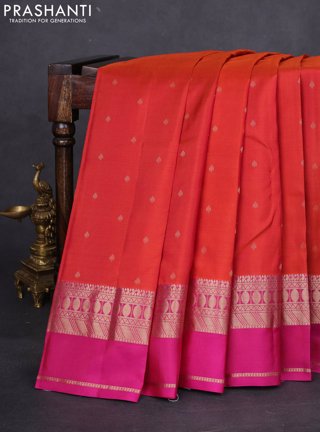 Pure kanchipuram silk saree dual shade of rustic orange and magenta pink with allover zari woven buttas and rettapet zari woven border
