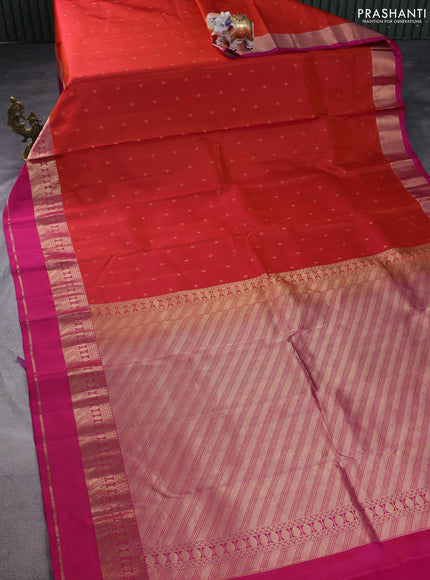 Pure kanchipuram silk saree dual shade of rustic orange and magenta pink with allover zari woven buttas and rettapet zari woven border
