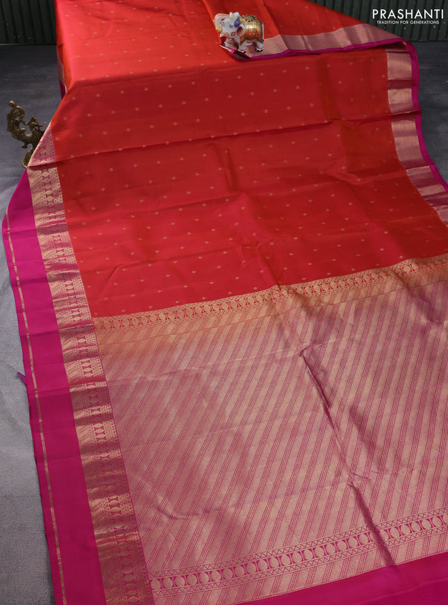 Pure kanchipuram silk saree dual shade of rustic orange and magenta pink with allover zari woven buttas and rettapet zari woven border