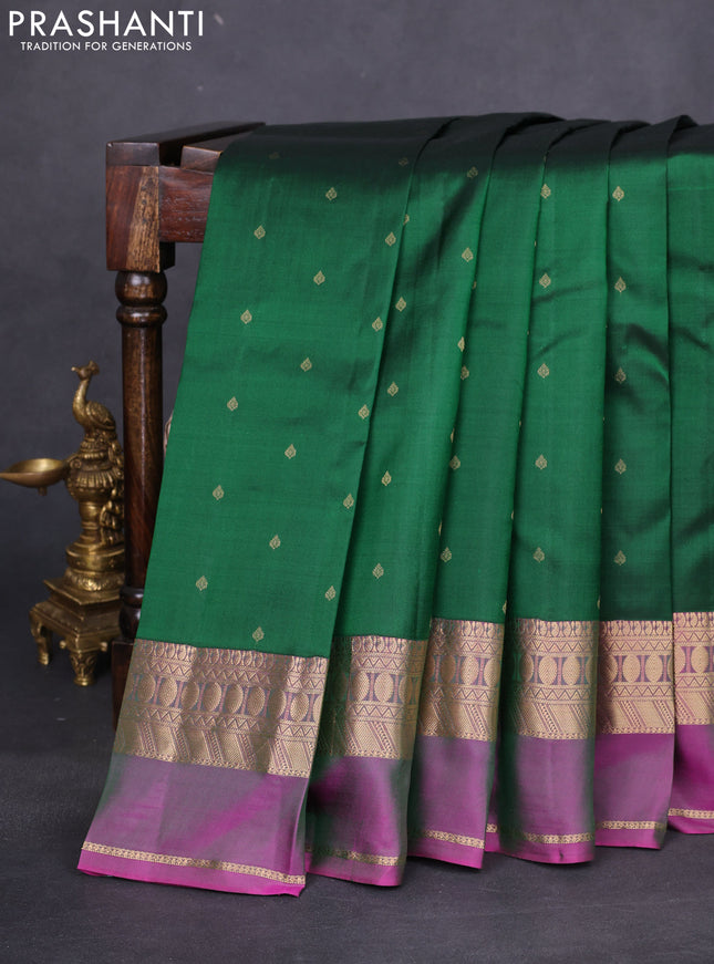 Pure kanchipuram silk saree dark green and dual shade of purple with allover zari woven buttas and rettapet zari woven border
