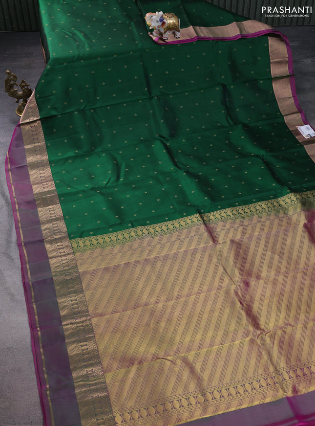 Pure kanchipuram silk saree dark green and dual shade of purple with allover zari woven buttas and rettapet zari woven border