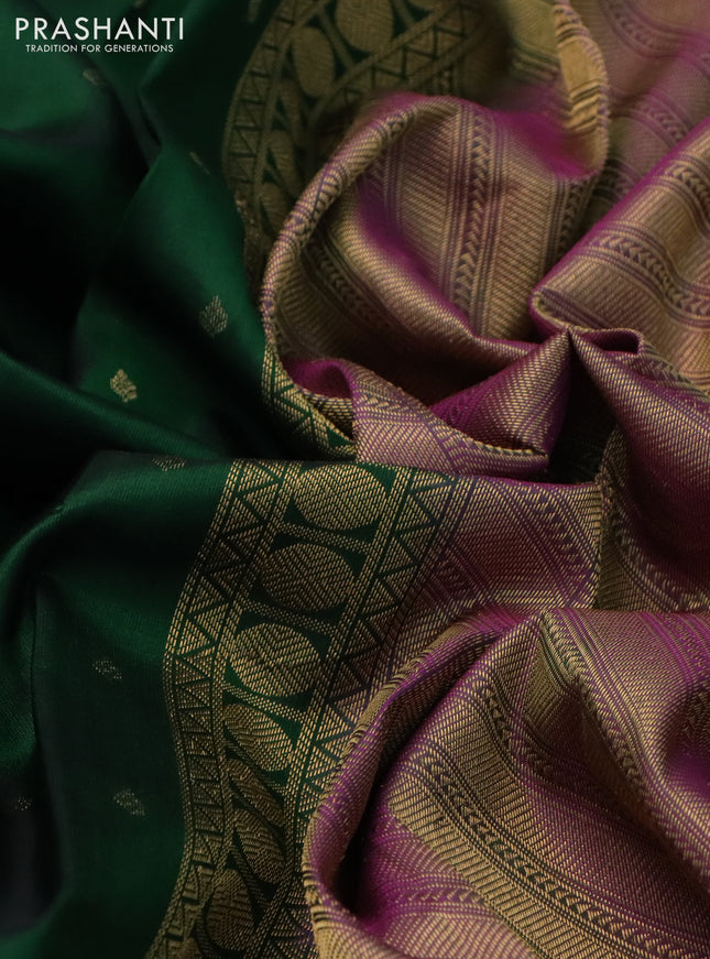 Pure kanchipuram silk saree dark green and dual shade of purple with allover zari woven buttas and rettapet zari woven border