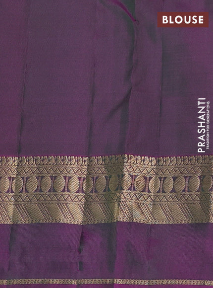 Pure kanchipuram silk saree dark green and dual shade of purple with allover zari woven buttas and rettapet zari woven border
