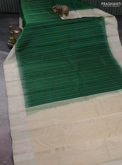 Pure kanchipuram silk saree green and beige with allover zari weaves and simple border