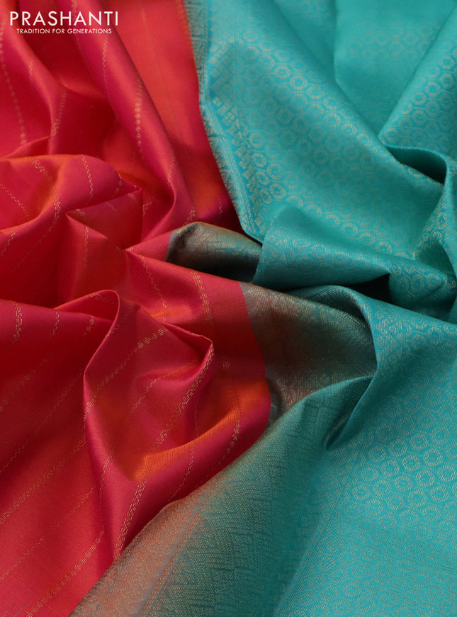 Pure kanchipuram silk saree dual shade of pinkish orange and teal blue with allover zari weaves and simple border