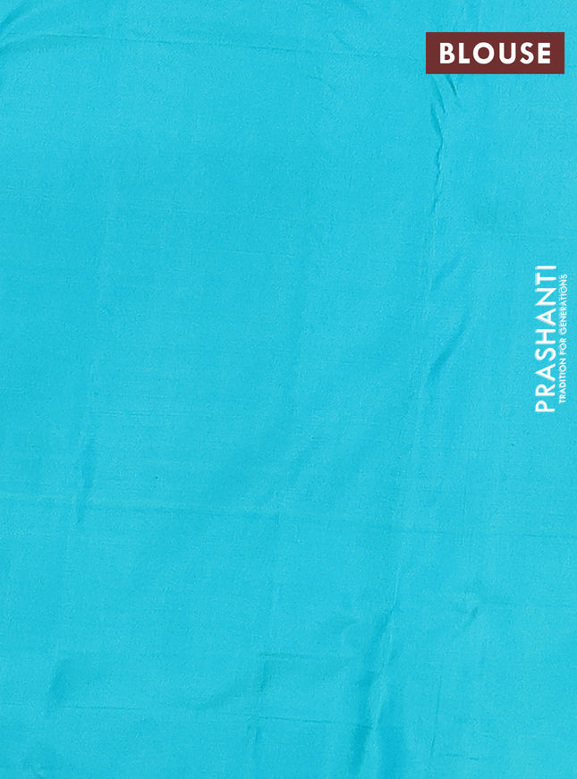 Pure kanchipuram silk saree dual shade of pinkish orange and teal blue with allover zari weaves and simple border