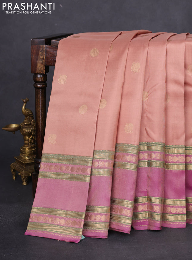Pure kanchipuram silk saree sandal and dual shade of purple with zari woven buttas and long rettapet zari woven border