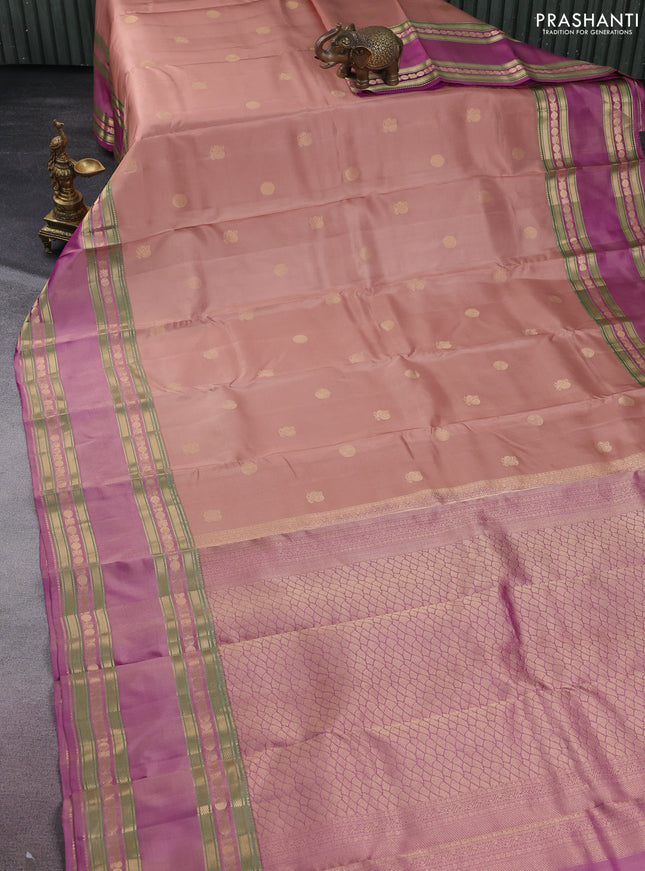Pure kanchipuram silk saree sandal and dual shade of purple with zari woven buttas and long rettapet zari woven border
