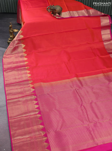 Pure kanchipuram silk saree dual shade of orange and pink with plain body and long temple zari woven border