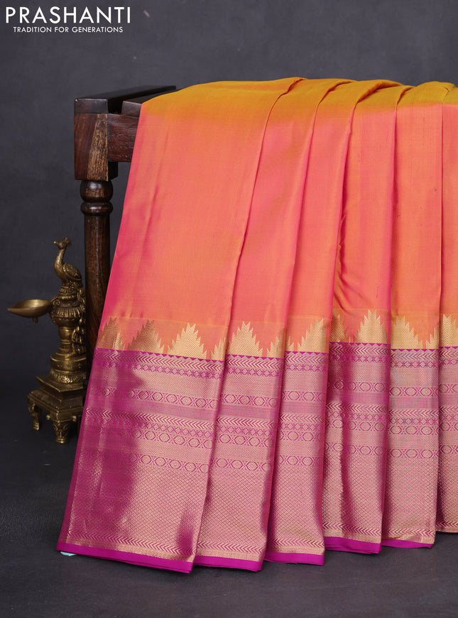 Pure kanchipuram silk saree dual shade of yellowish pink and purple with plain body and long temple zari woven border