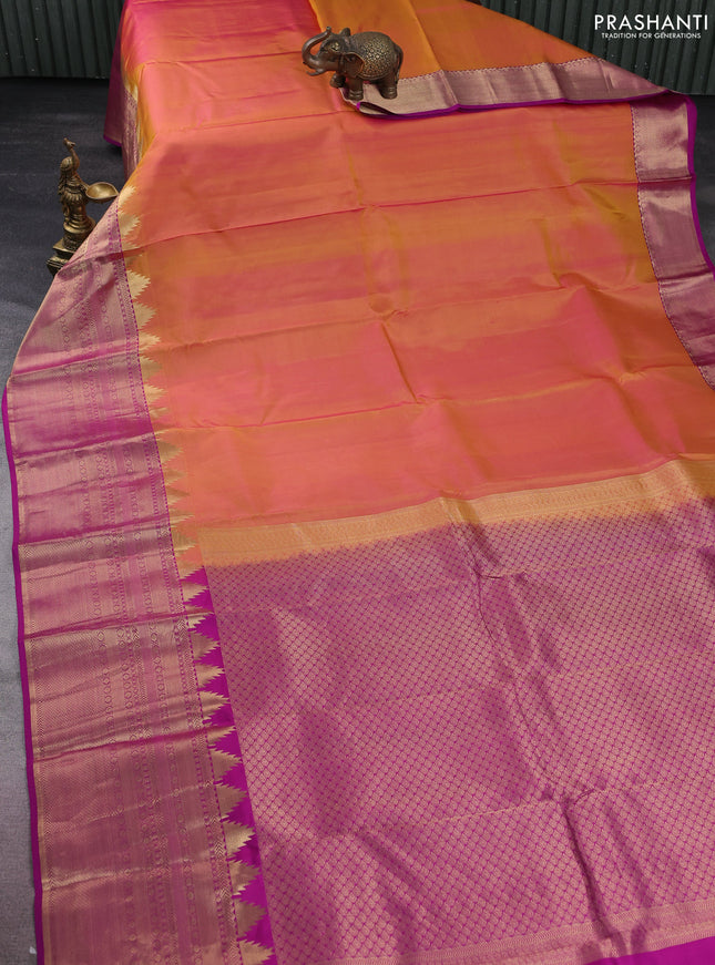 Pure kanchipuram silk saree dual shade of yellowish pink and purple with plain body and long temple zari woven border
