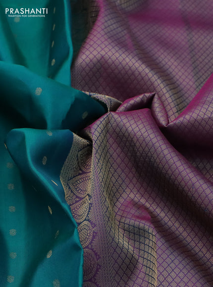 Pure kanchipuram silk saree dual shade of teal bluish green and dual shade of purple with allover zari woven buttas and long zari woven korvai border