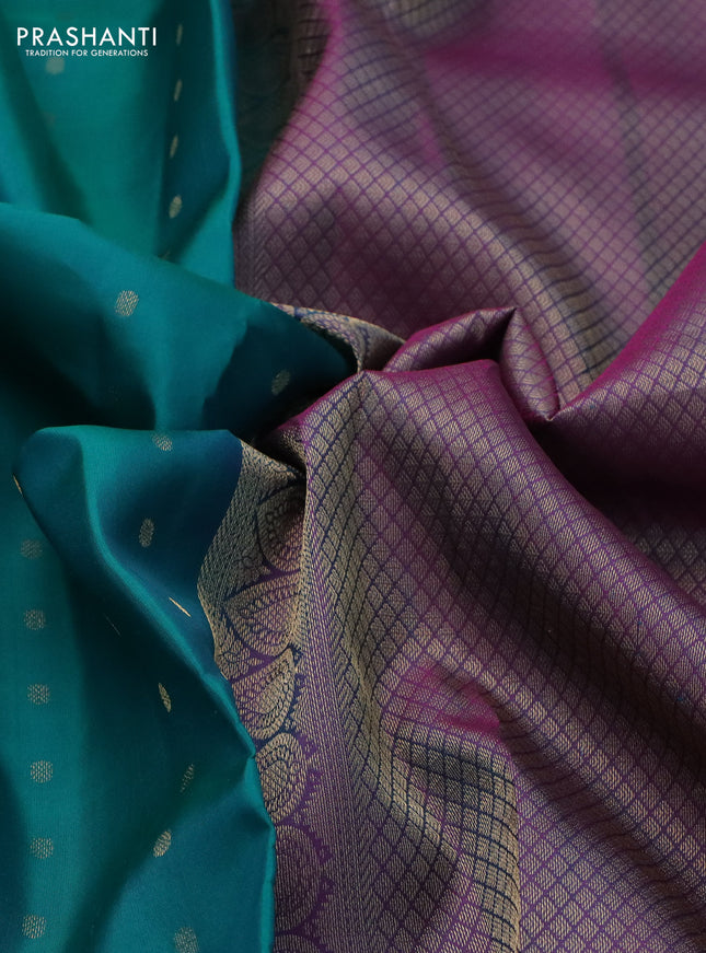 Pure kanchipuram silk saree dual shade of teal bluish green and dual shade of purple with allover zari woven buttas and long zari woven korvai border