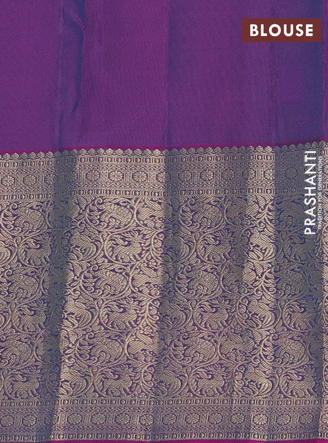 Pure kanchipuram silk saree dual shade of teal bluish green and dual shade of purple with allover zari woven buttas and long zari woven korvai border
