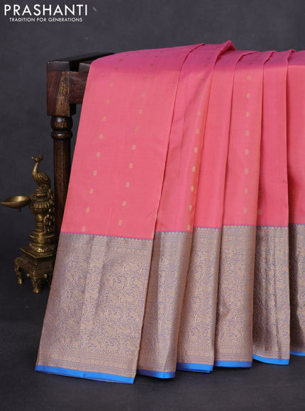 Pure kanchipuram silk saree peach shade and dual shade of blue with allover zari woven buttas and long zari woven korvai border