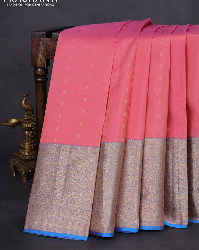 Pure kanchipuram silk saree peach shade and dual shade of blue with allover zari woven buttas and long zari woven korvai border