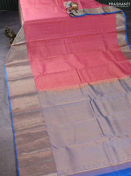 Pure kanchipuram silk saree peach shade and dual shade of blue with allover zari woven buttas and long zari woven korvai border
