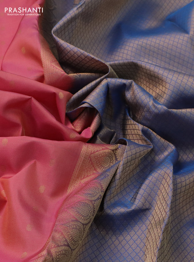 Pure kanchipuram silk saree peach shade and dual shade of blue with allover zari woven buttas and long zari woven korvai border