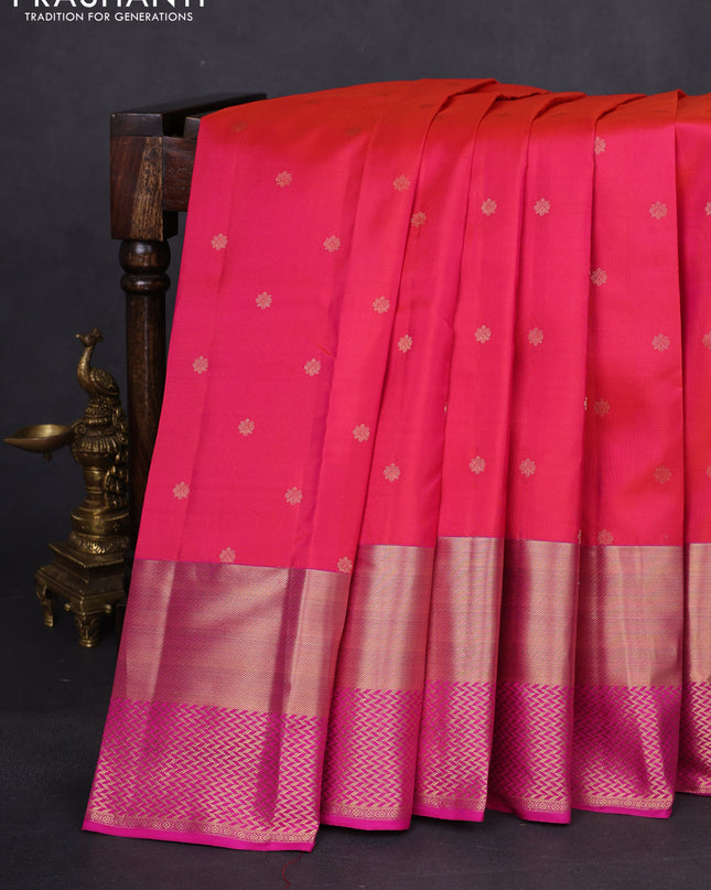 Pure kanchipuram silk saree dual shade of pinkish orange and pink with allover zari woven buttas and long zari woven border