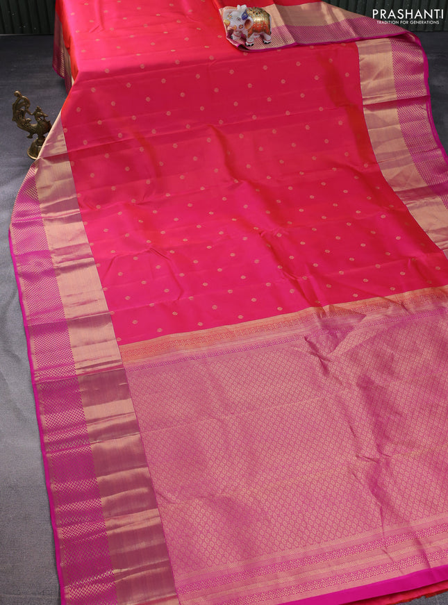 Pure kanchipuram silk saree dual shade of pinkish orange and pink with allover zari woven buttas and long zari woven border