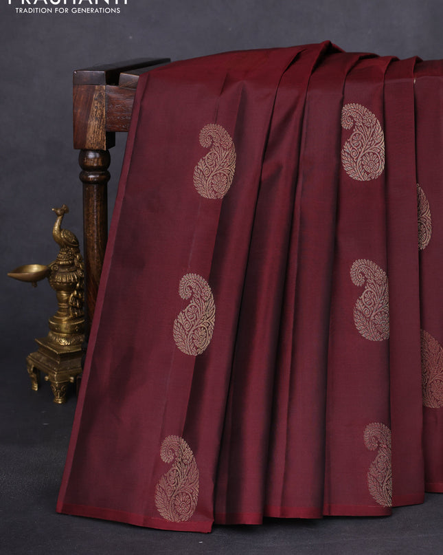 Pure kanchipuram silk saree deep maroon and teal green with zari woven paisley buttas in borderless style